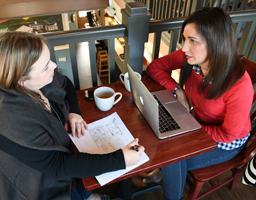 Riveter's Jordan and Lauren at work